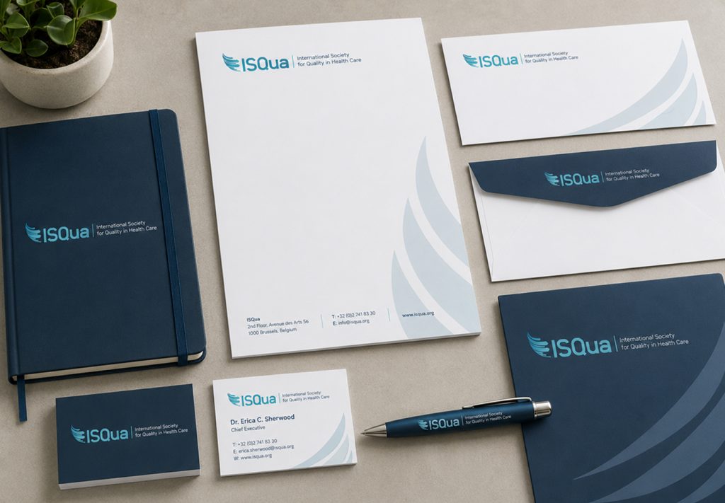 ISQua letterhead, envelopes, notebook and business card flat-lay
